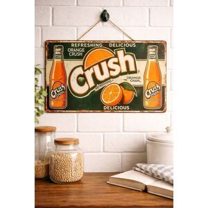 Classic vintage-inspired Orange Crush metal wall sign featuring retro soda bottl